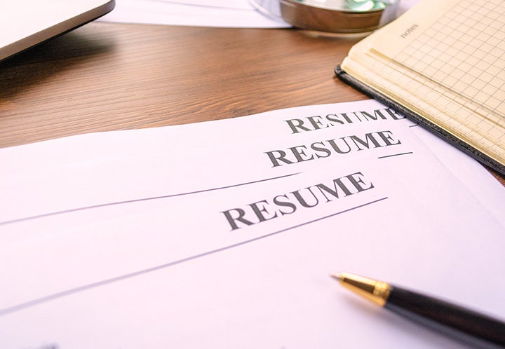 A piece of paper with "Resume" written on it