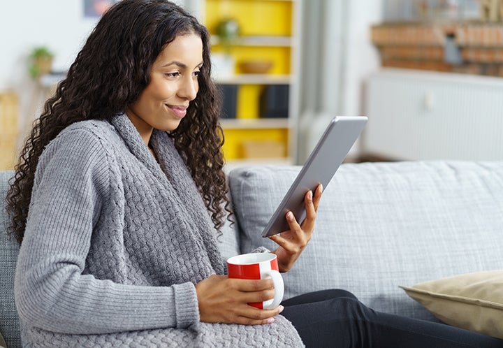 Lady looking at her tablet