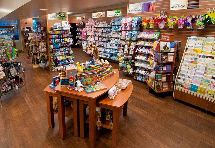 A gift shop showcasing a wide array of toys and books for sale