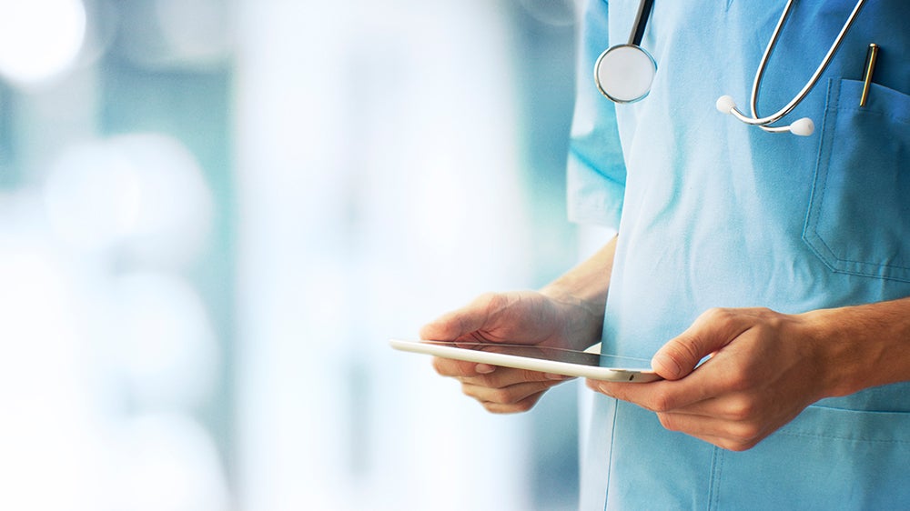 medical provider holding clipboard