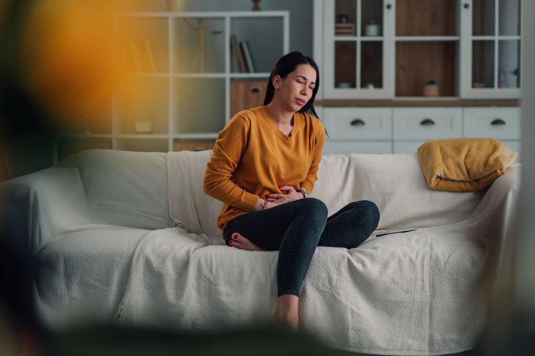 Woman experiencing stomach pain