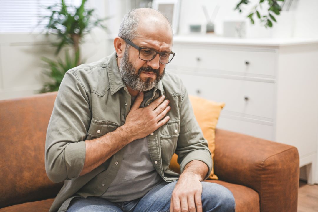 Man experiencing GERD symptoms